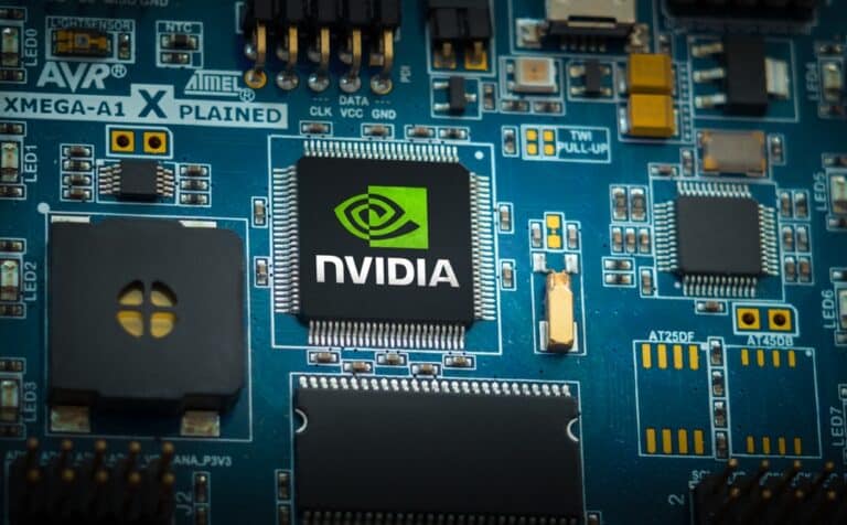 Close-up of a blue circuit board with a NVIDIA chip and various components.