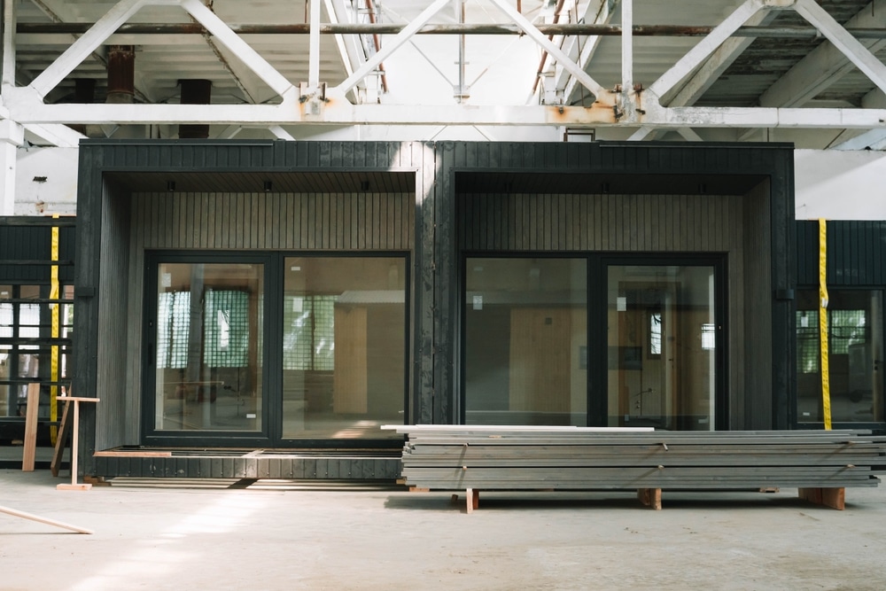 A new wooden modular prefabricated house inside in manufacturing facility